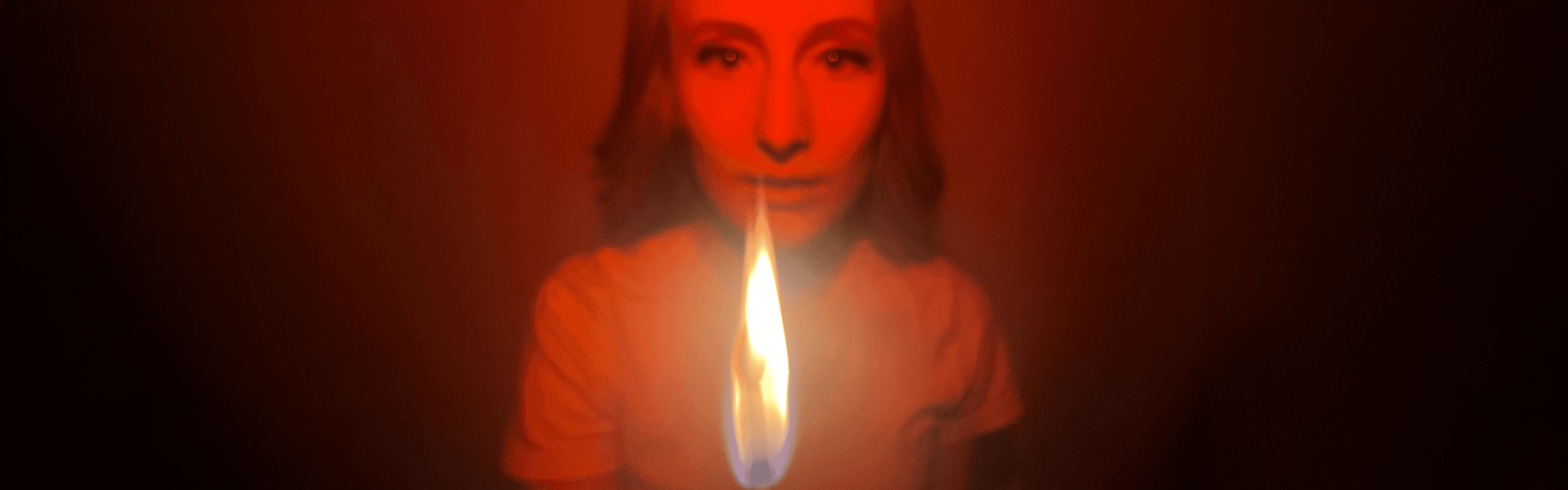 Background image: Ronja Lindbach holding a burning matchstick.